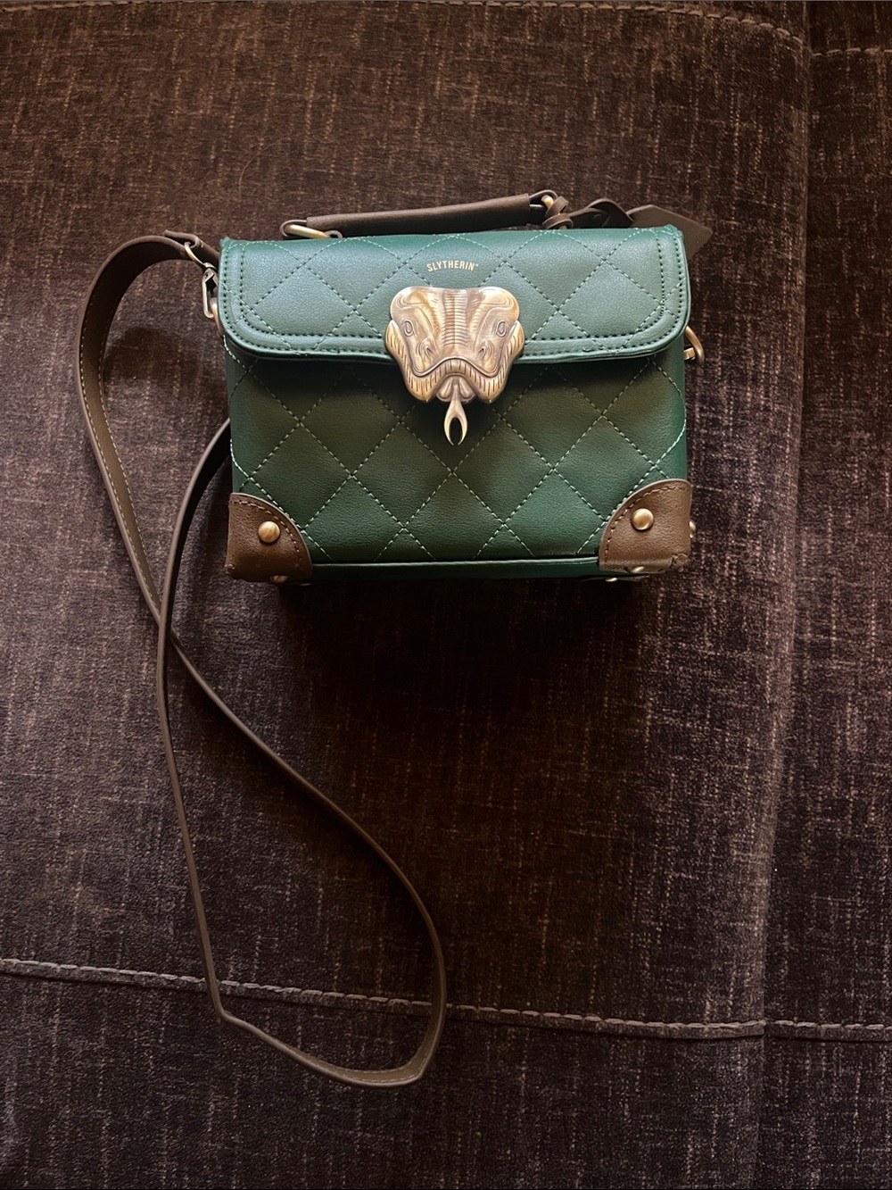 Never worn Slytherin small cross body quilted bag.
